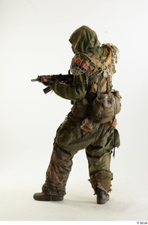 Photos John Hopkins Army Postapocalyptic Suit Poses aiming the gun…